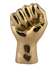 the solidarity fist sculpture in brass design by noir 1