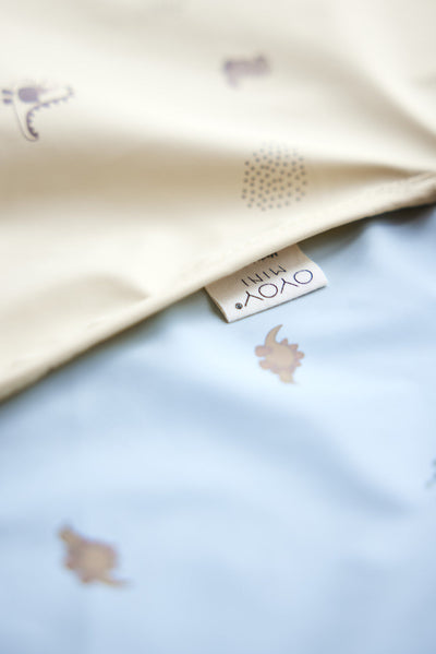 product image for dino cape bib in dusty green 2 74