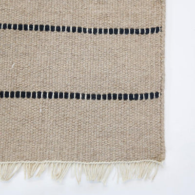 product image for warby handwoven rug in natural in multiple sizes design by pom pom at home 7 5